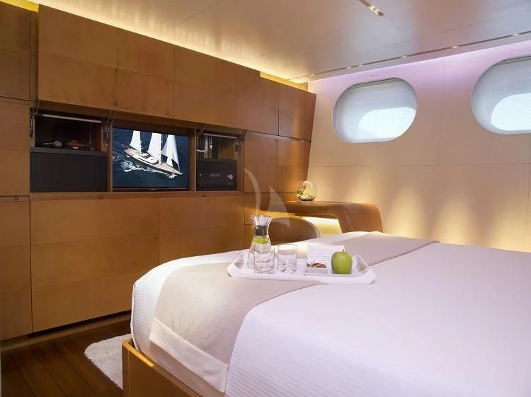 a room with a table and chairs aboard PANTHALASSA Yacht for Sale