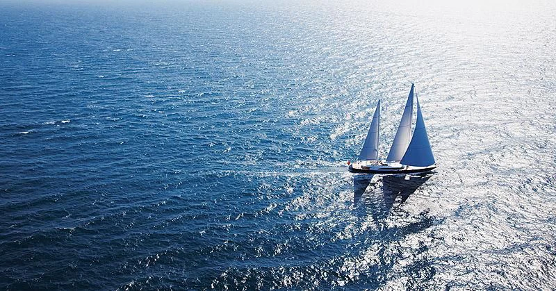 a boat sailing on the sea aboard PANTHALASSA Yacht for Sale