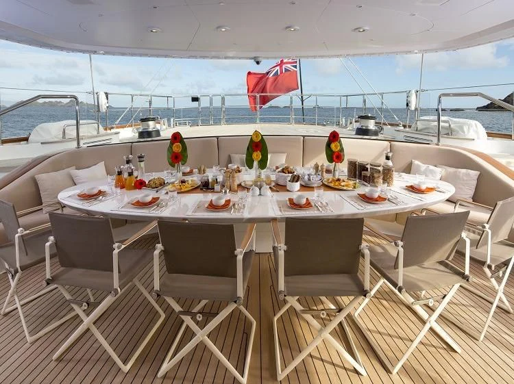 a table with food on it aboard PANTHALASSA Yacht for Sale