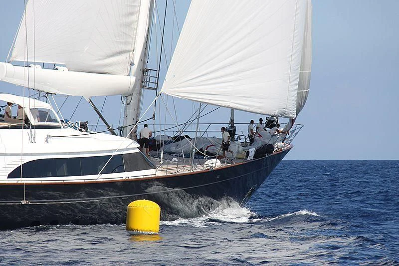 a sailboat with people on it aboard PANTHALASSA Yacht for Sale