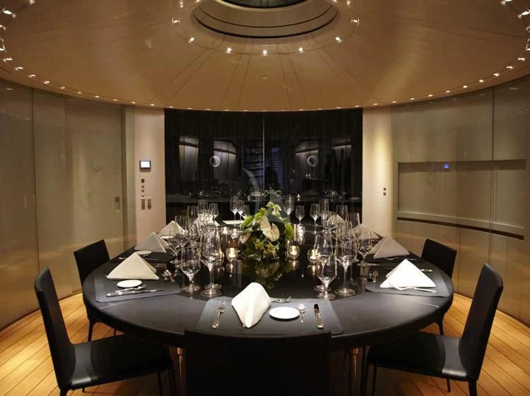 a table set for a formal dinner aboard PANTHALASSA Yacht for Sale