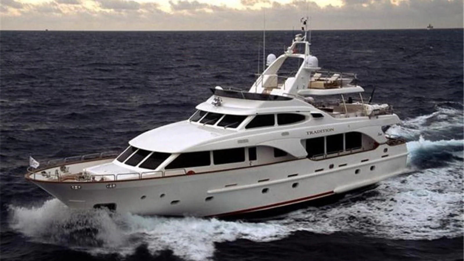 a white yacht on the water aboard BENETTI TRADITION 100 Yacht for Sale