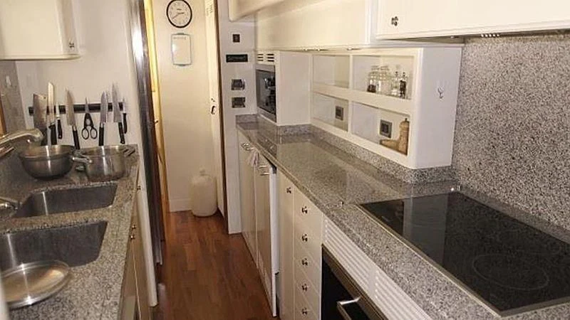 a kitchen with a sink and a microwave aboard BENETTI TRADITION 100 Yacht for Sale