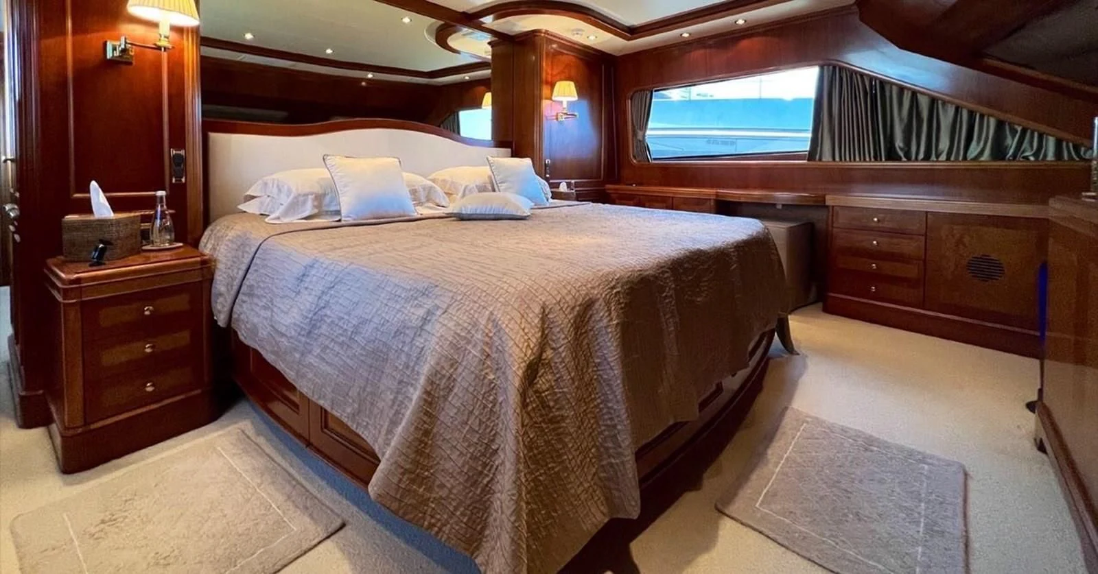 a bed with a large bed aboard BENETTI TRADITION 100 Yacht for Sale