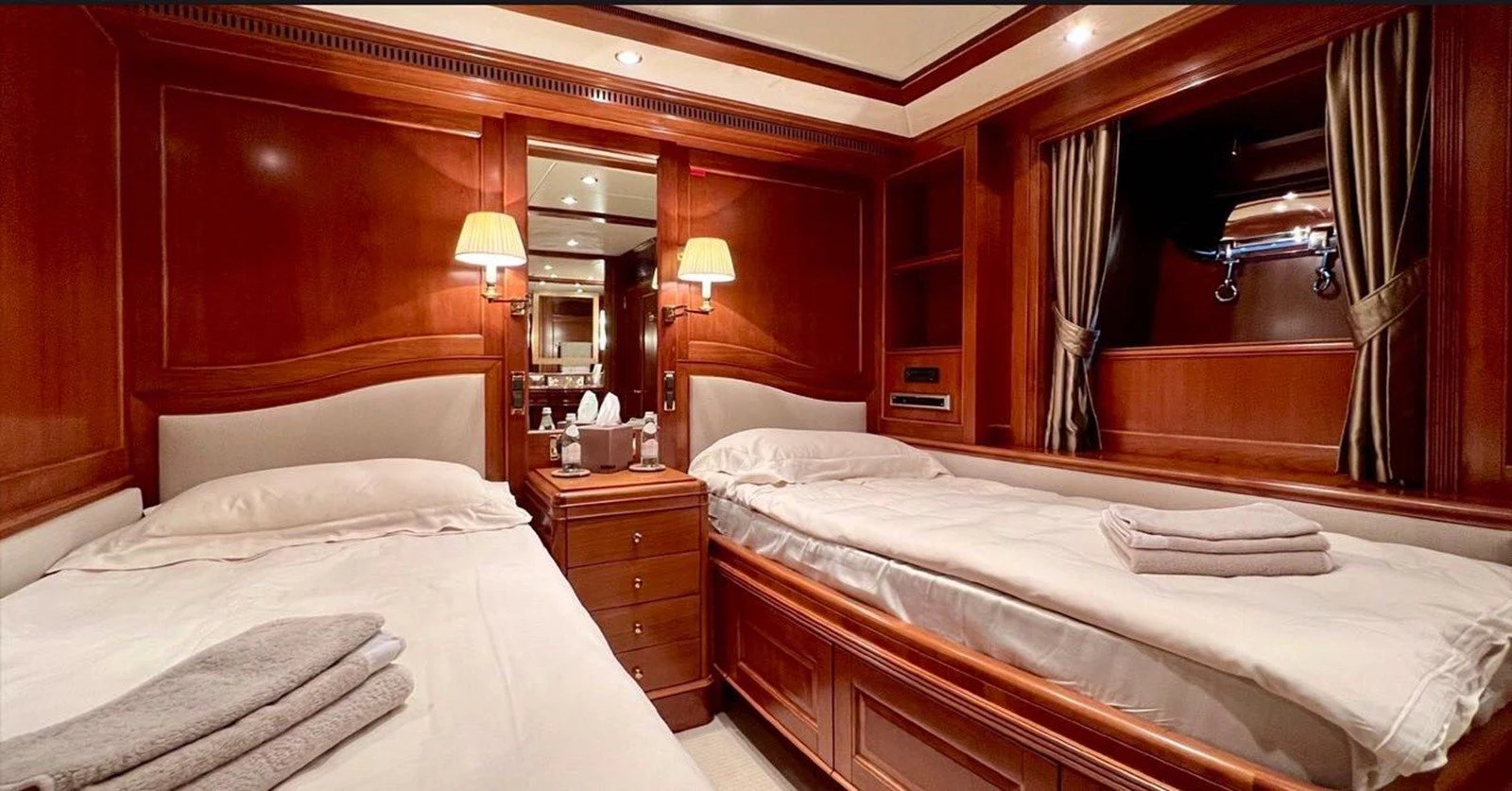 a room with two beds aboard BENETTI TRADITION 100 Yacht for Sale
