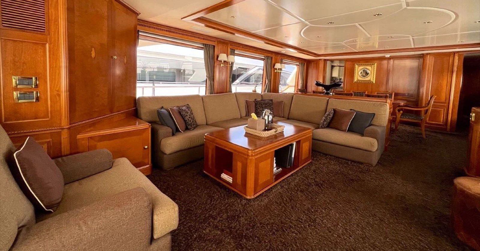 a living room with a couch and a coffee table aboard BENETTI TRADITION 100 Yacht for Sale