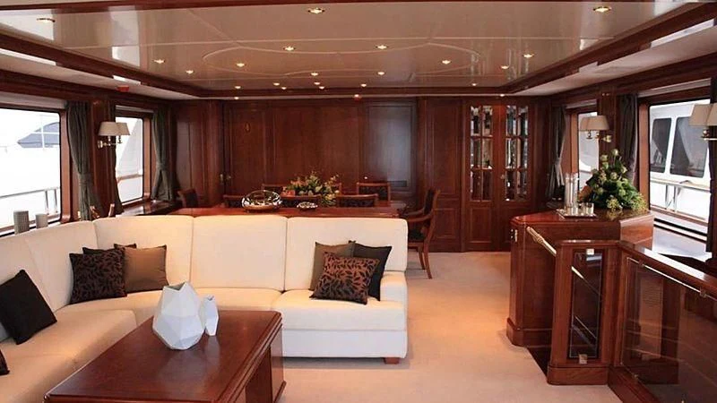 a living room with a white couch aboard BENETTI TRADITION 100 Yacht for Sale
