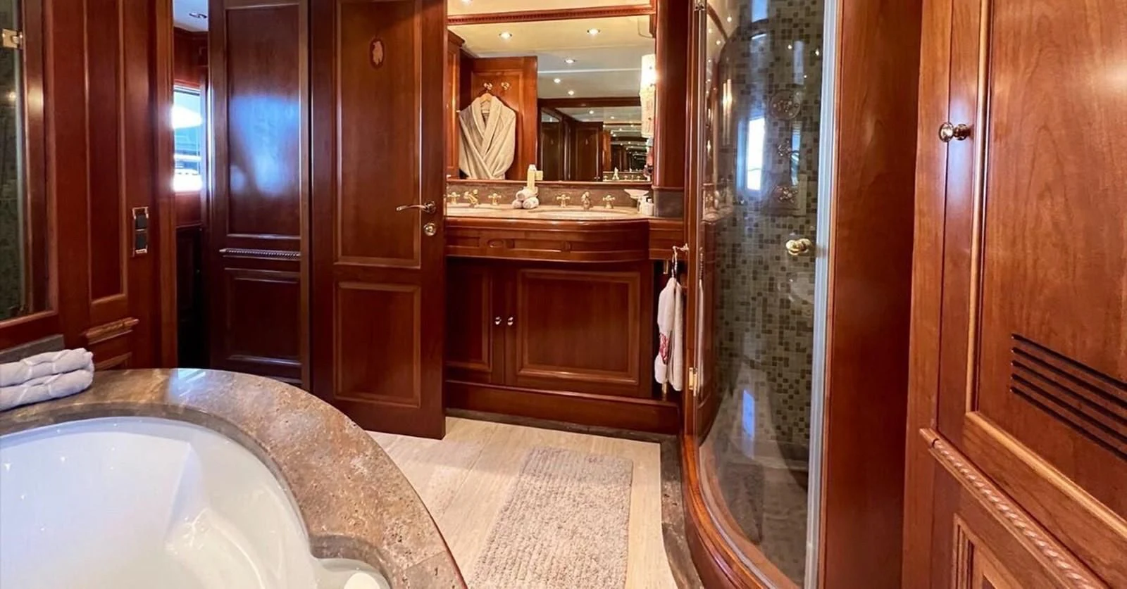 a bathroom with a bathtub and a shower unit aboard BENETTI TRADITION 100 Yacht for Sale