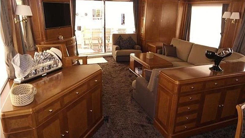 a living room with a couch and a table aboard BENETTI TRADITION 100 Yacht for Sale