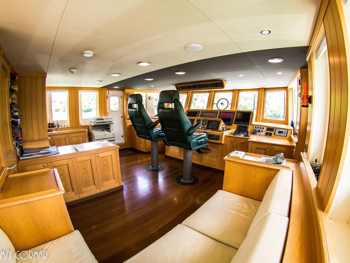 a room with a couch and chairs aboard MARIS STELLA Yacht for Sale