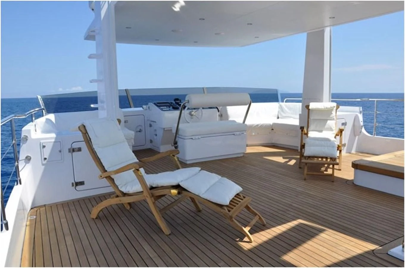 a deck with chairs on it aboard MARIS STELLA Yacht for Sale