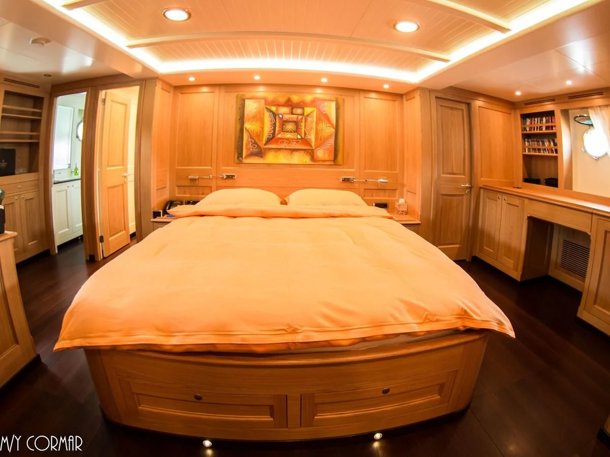 a large bed in a room aboard MARIS STELLA Yacht for Sale