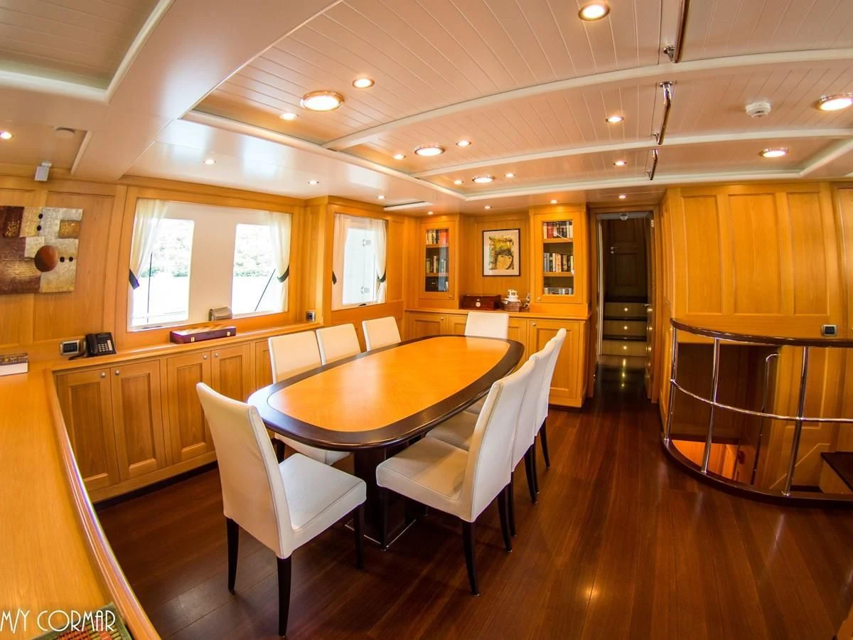 a dining room with a table and chairs aboard MARIS STELLA Yacht for Sale