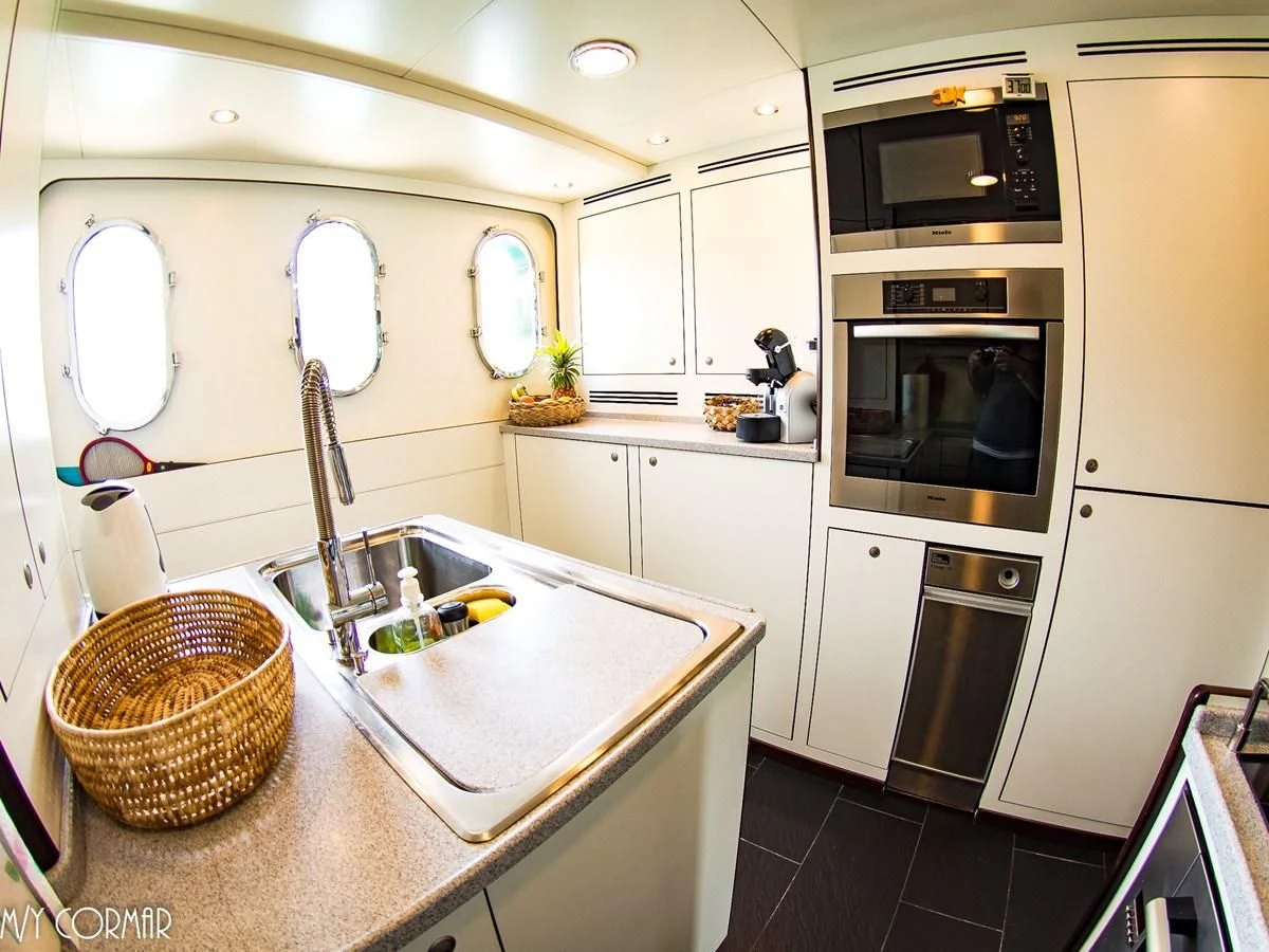 a kitchen with a sink and microwave aboard MARIS STELLA Yacht for Sale
