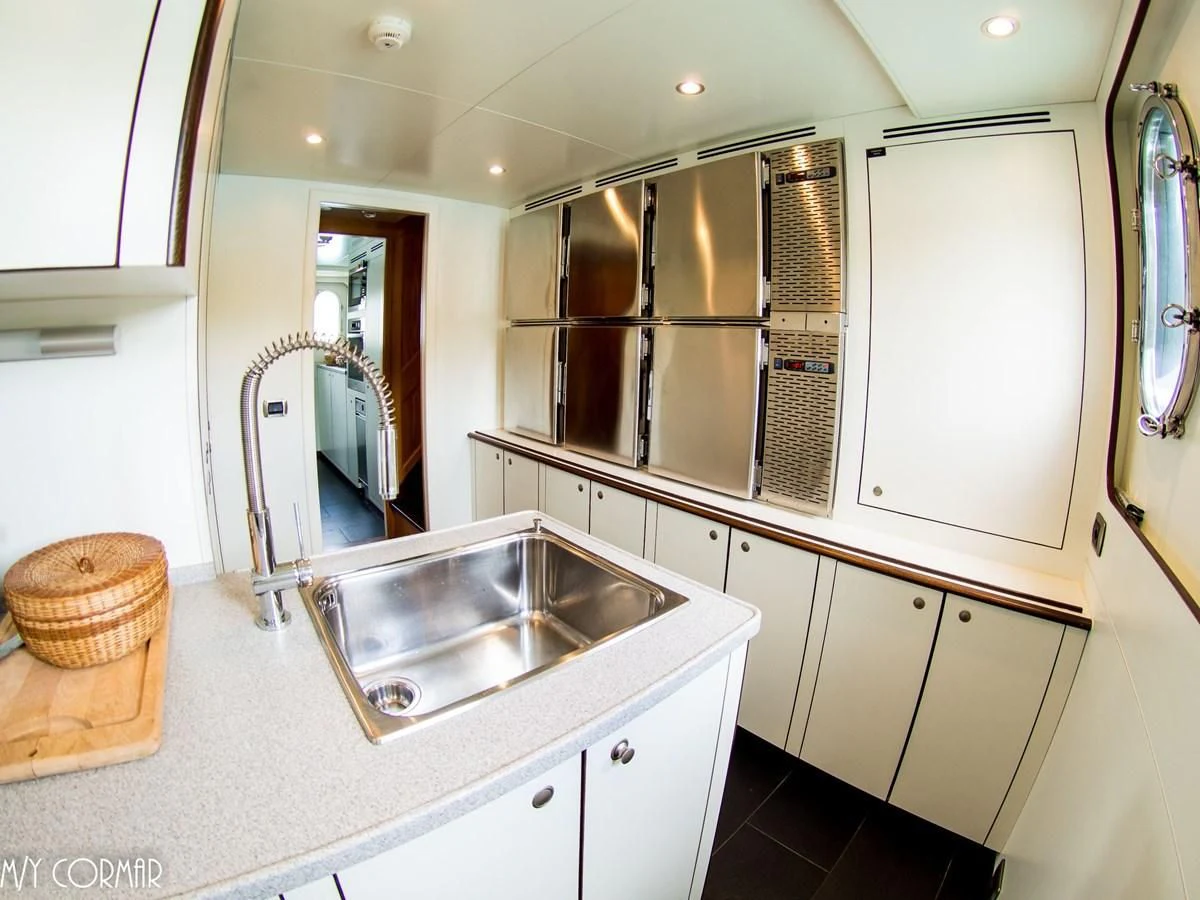a kitchen with a sink and cabinets aboard MARIS STELLA Yacht for Sale