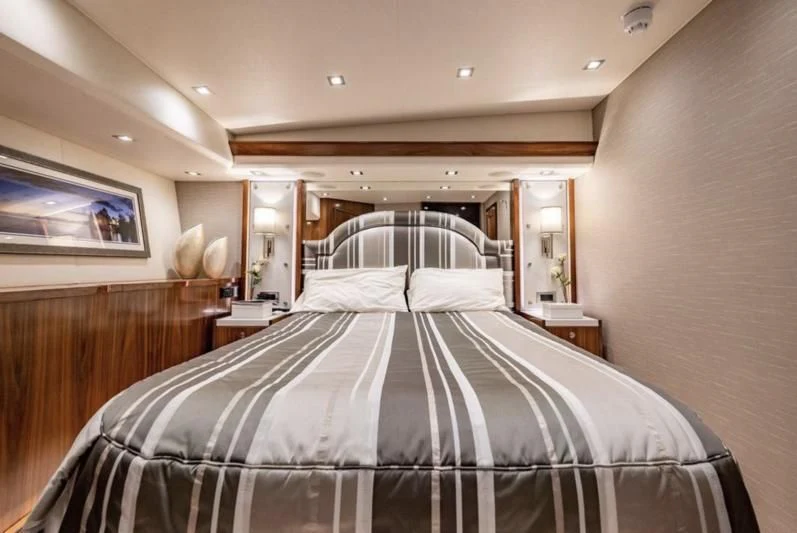 a room with a bed and a mirror aboard 17 Yacht for Sale