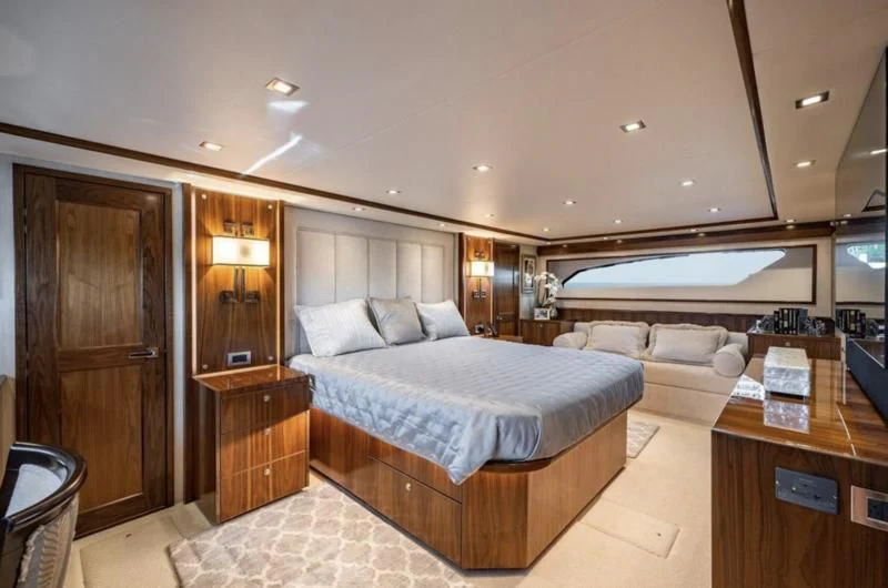 a hotel room with a bed and a desk aboard 17 Yacht for Sale