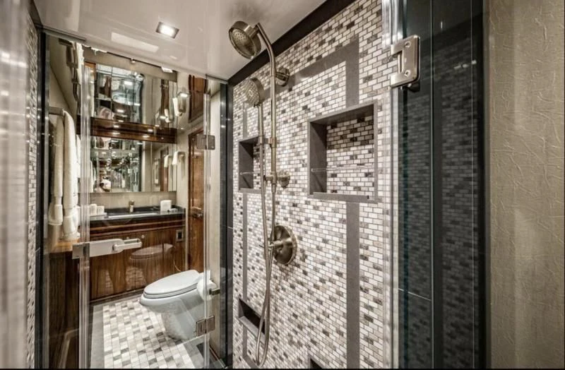 a bathroom with a shower unit aboard 17 Yacht for Sale