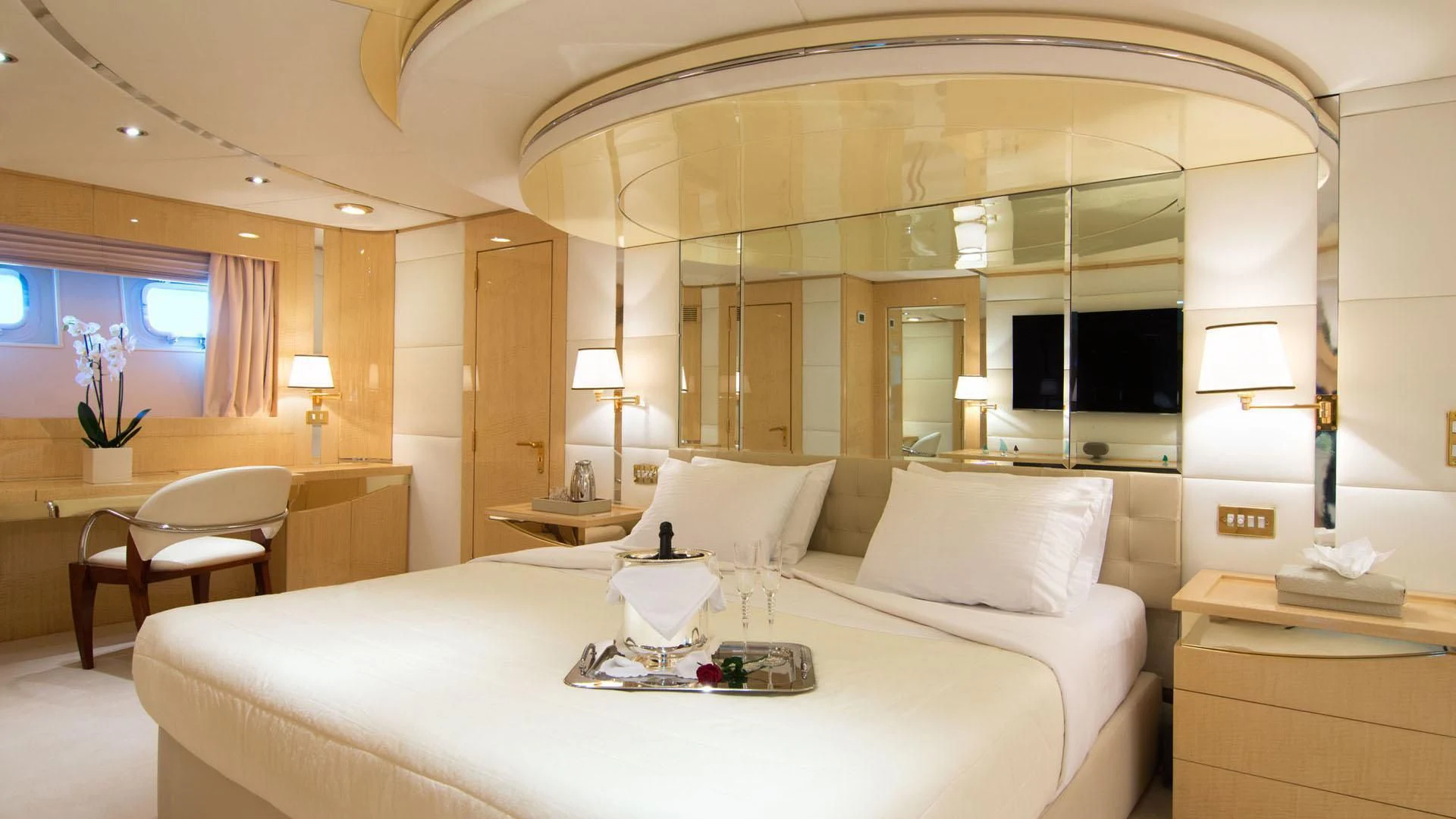 a hotel room with a bed and a desk aboard O'NATALINA Yacht for Sale
