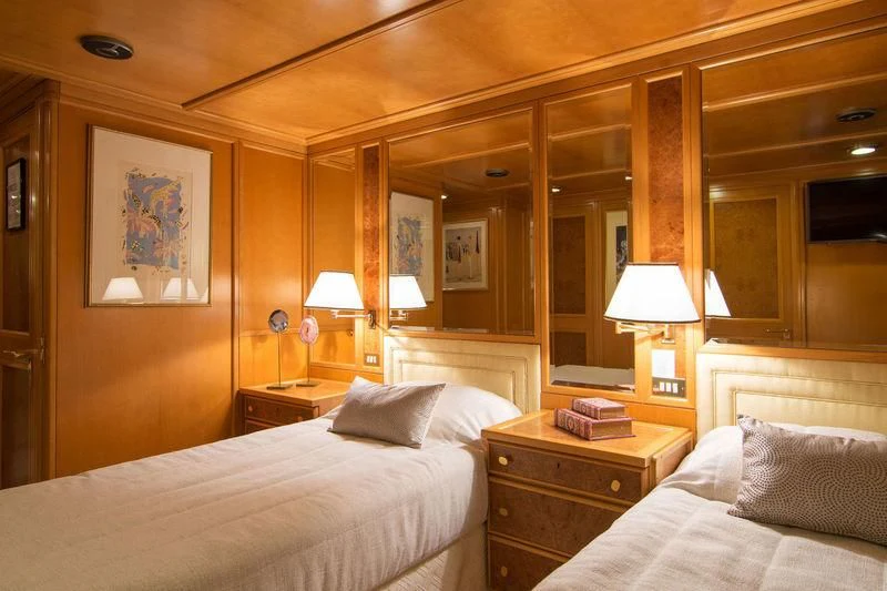 a hotel room with two beds aboard O'NATALINA Yacht for Sale