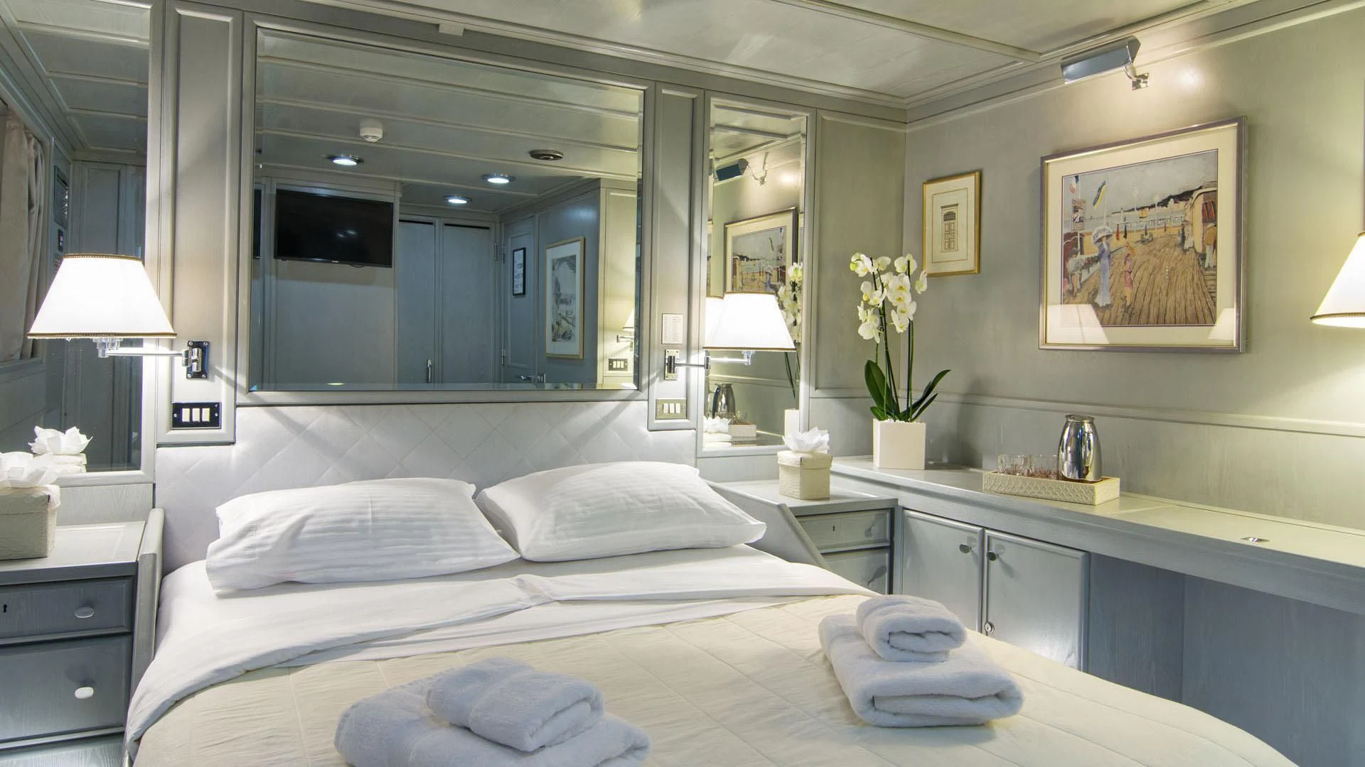 a large white bed with white pillows aboard O'NATALINA Yacht for Sale