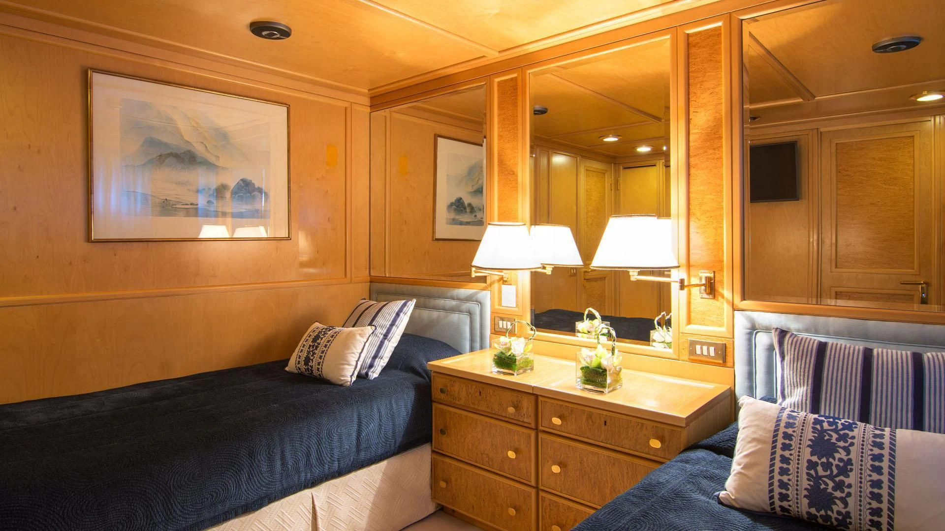 a hotel room with a bed and a mirror aboard O'NATALINA Yacht for Sale