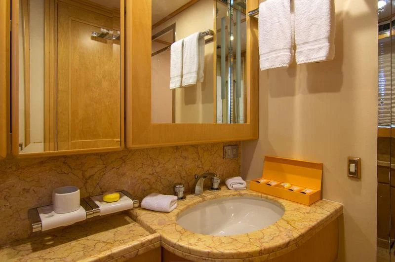 a bathroom with a sink and a mirror aboard O'NATALINA Yacht for Sale