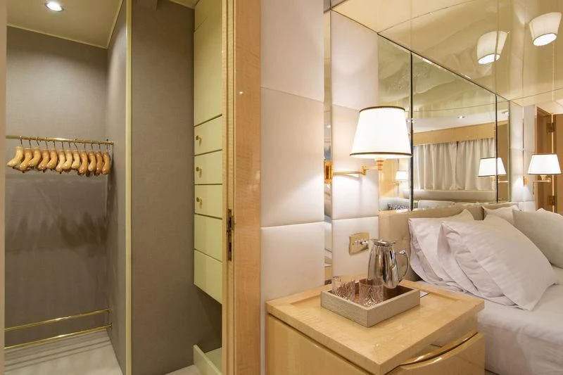 a room with a bed and a mirror aboard O'NATALINA Yacht for Sale