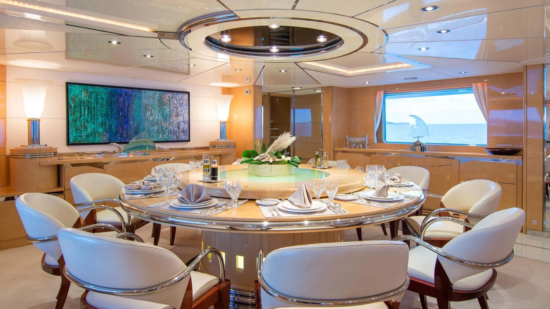 a large room with tables and chairs aboard O'NATALINA Yacht for Sale