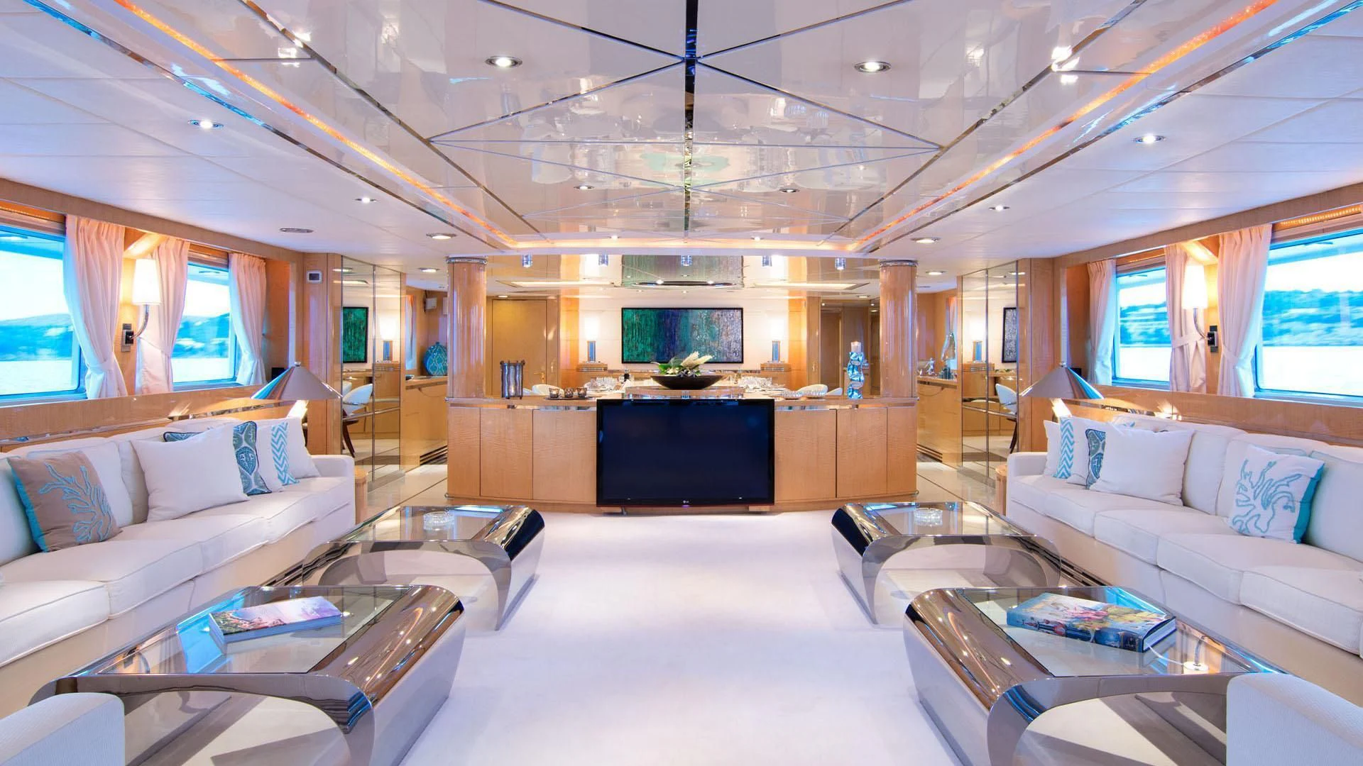 a large living room with a large screen aboard O'NATALINA Yacht for Sale