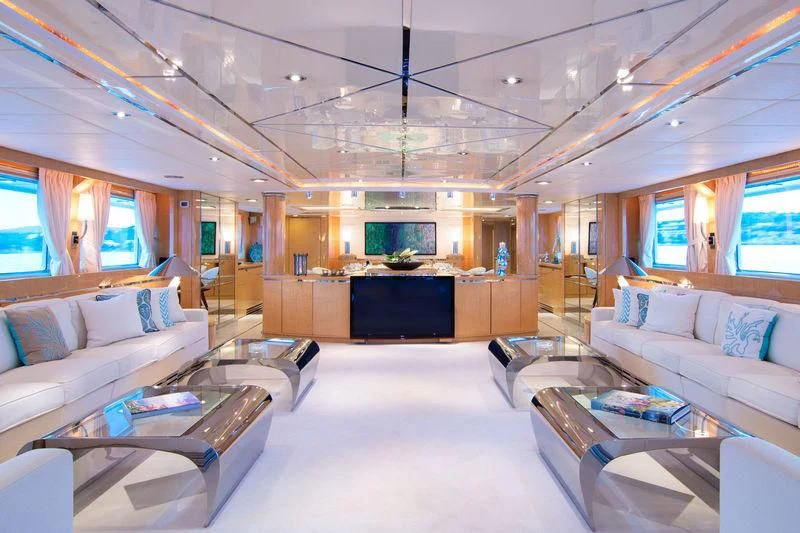 a living room with a large screen aboard O'NATALINA Yacht for Sale