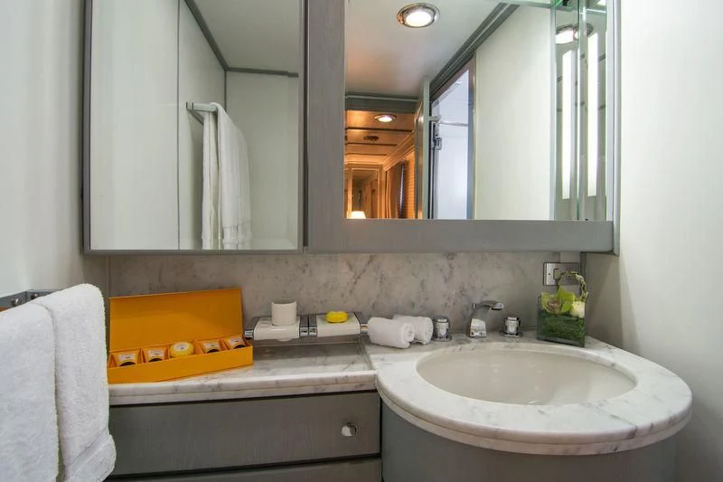 a bathroom with a large mirror aboard O'NATALINA Yacht for Sale