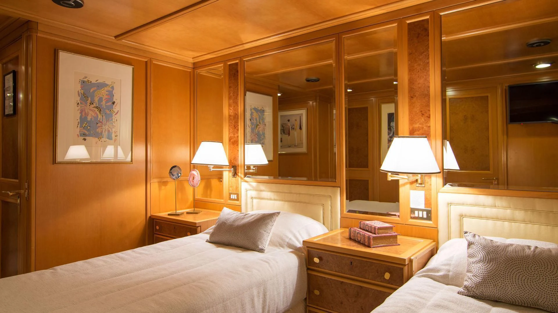 a hotel room with lamps and a bed aboard O'NATALINA Yacht for Sale