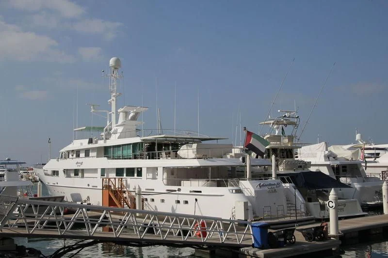 a large white boat with flags on it aboard O'NATALINA Yacht for Sale