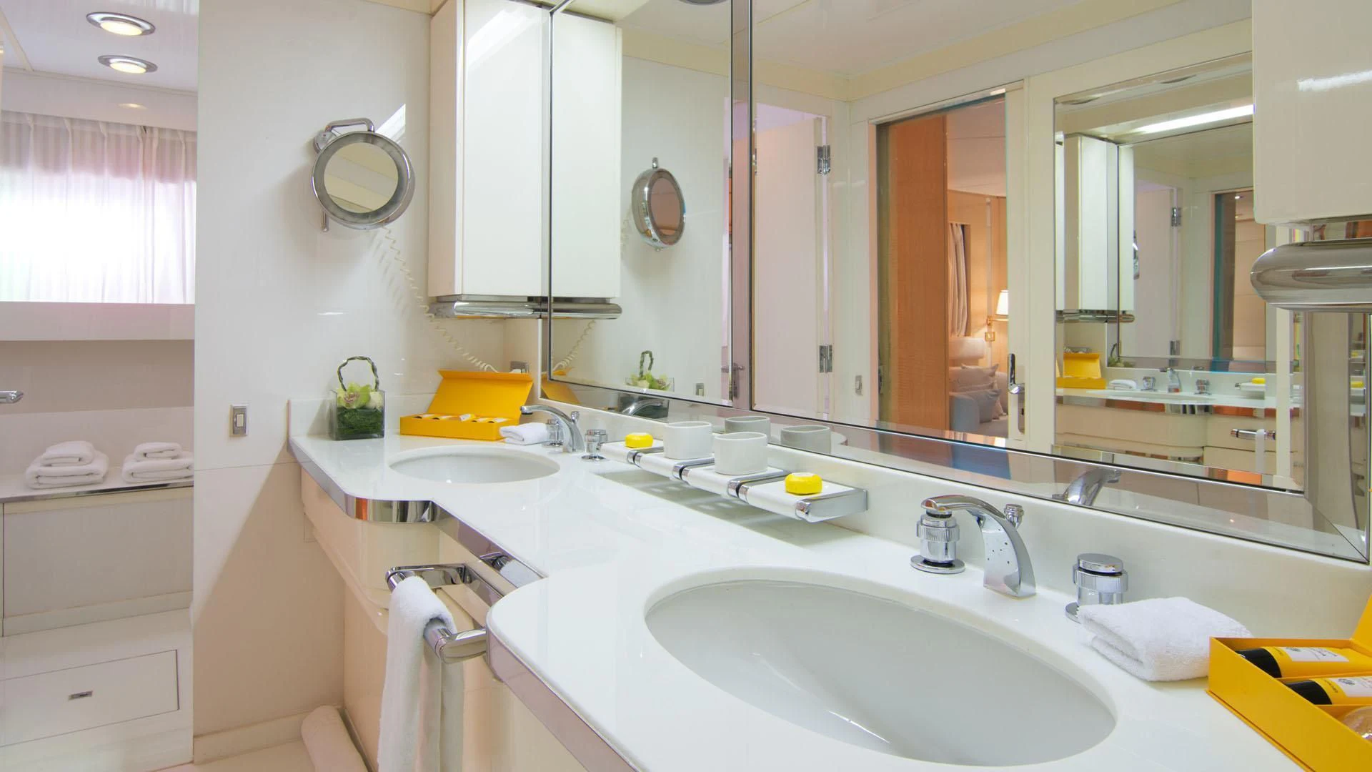 a bathroom with a large mirror aboard O'NATALINA Yacht for Sale