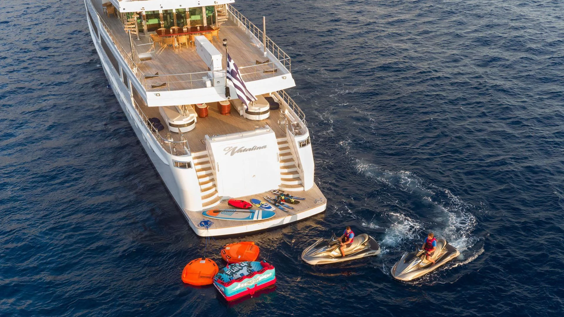 a boat with a person on it aboard O'NATALINA Yacht for Sale