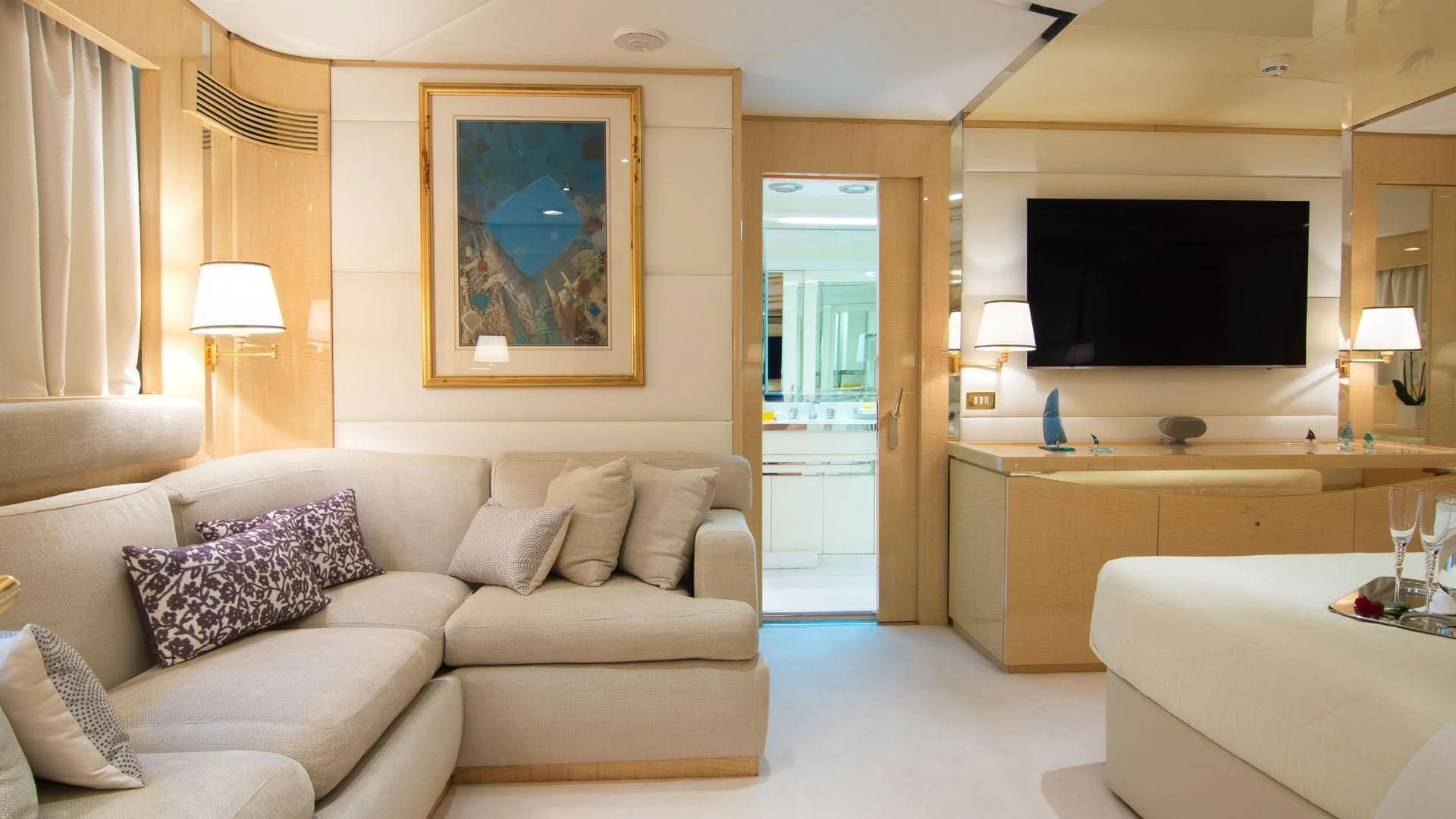 a living room with a large screen aboard O'NATALINA Yacht for Sale