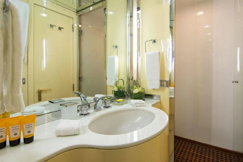 a bathroom with a sink and a mirror aboard O'NATALINA Yacht for Sale