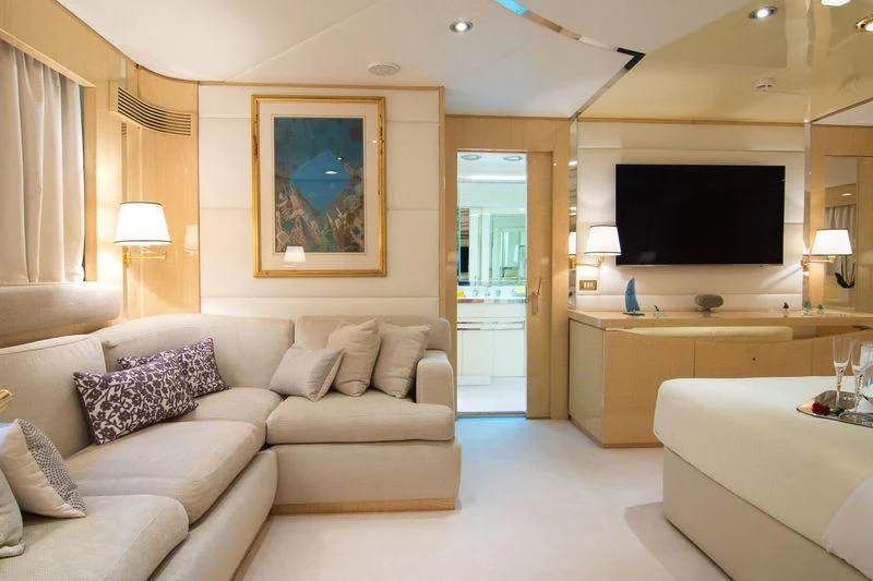 a living room with a large screen aboard O'NATALINA Yacht for Sale