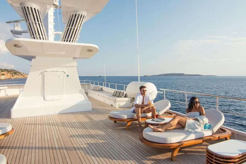 a group of people sitting on a boat on the water aboard O'NATALINA Yacht for Sale