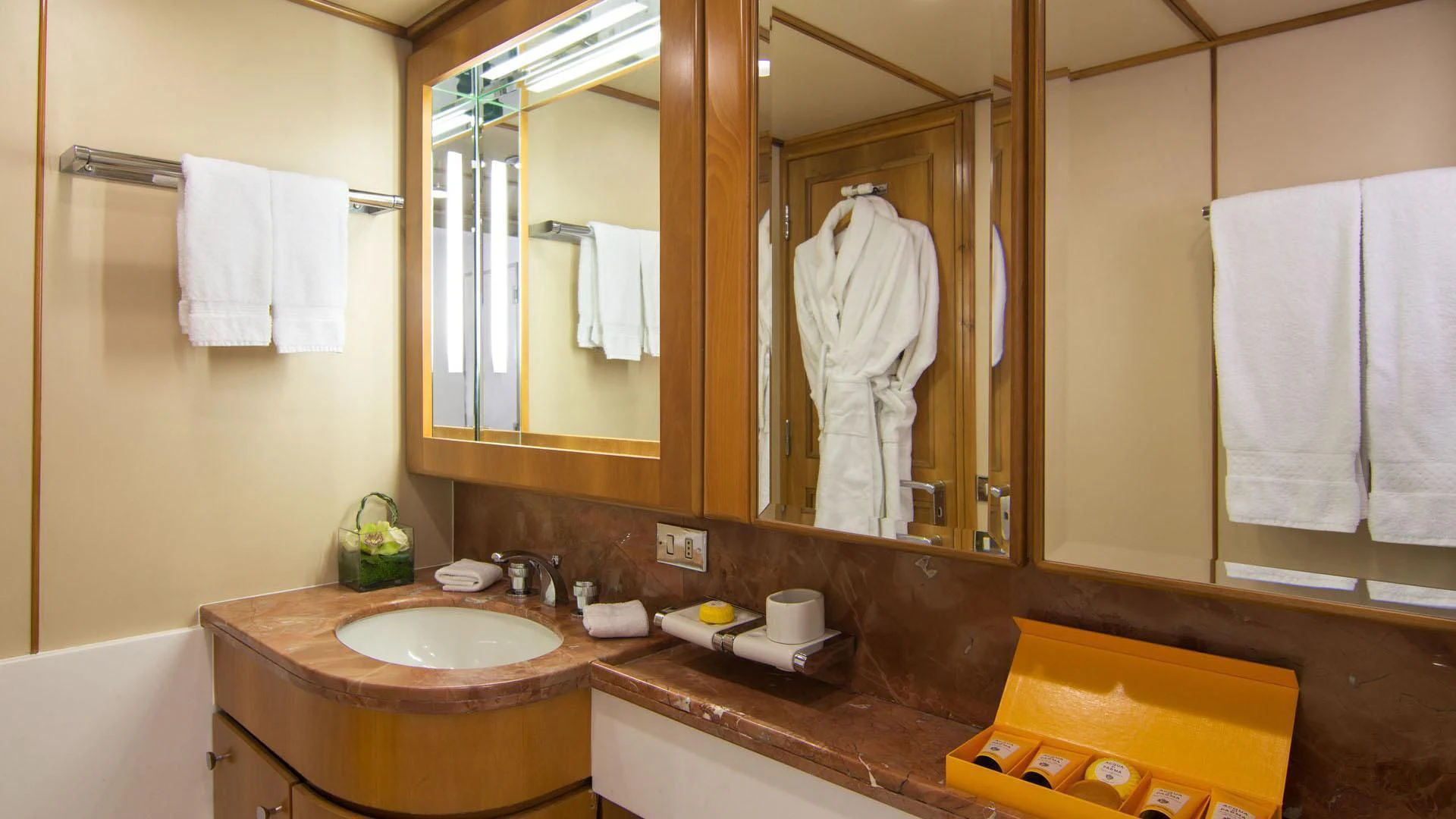 a bathroom with a large mirror aboard O'NATALINA Yacht for Sale