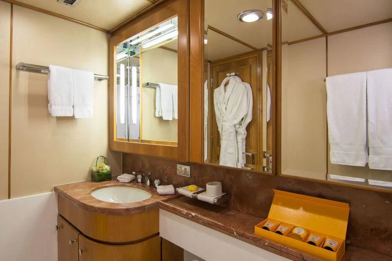 a bathroom with a large mirror aboard O'NATALINA Yacht for Sale