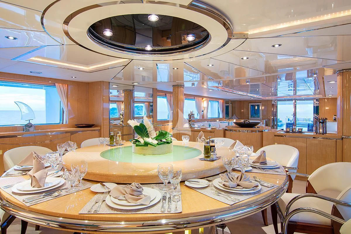 a large dining room with a table set for a meal aboard O'NATALINA Yacht for Sale
