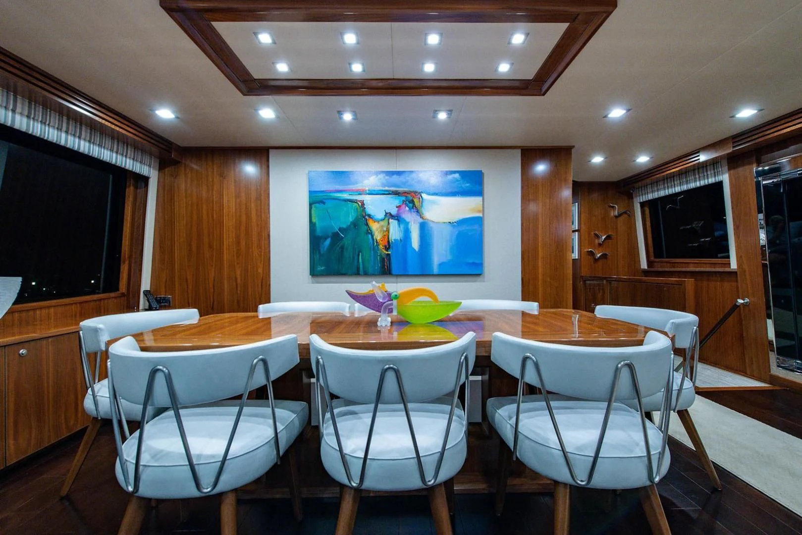 a room with tables and chairs aboard OBSESSION Yacht for Sale