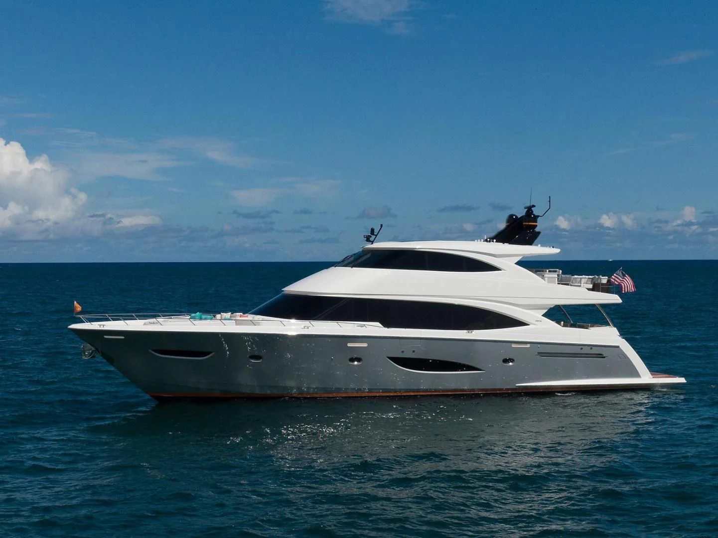 a white yacht in the water aboard OBSESSION Yacht for Sale