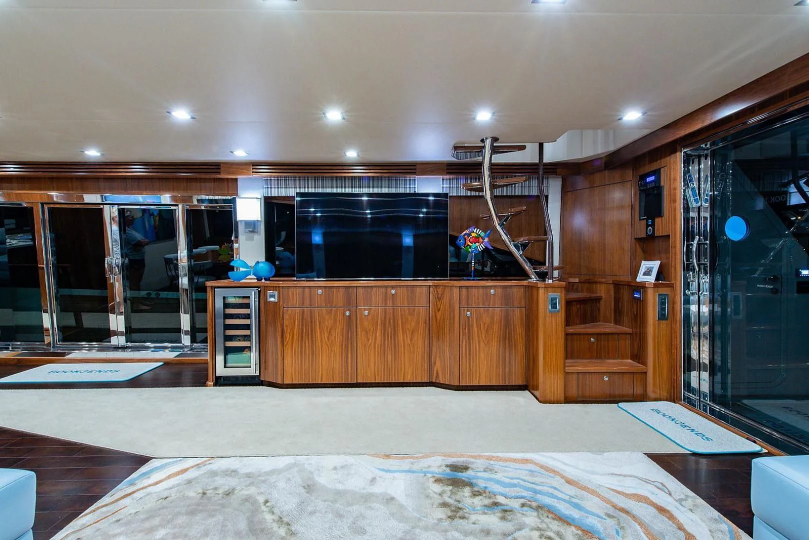 a large room with a large glass door and a large mirror aboard OBSESSION Yacht for Sale