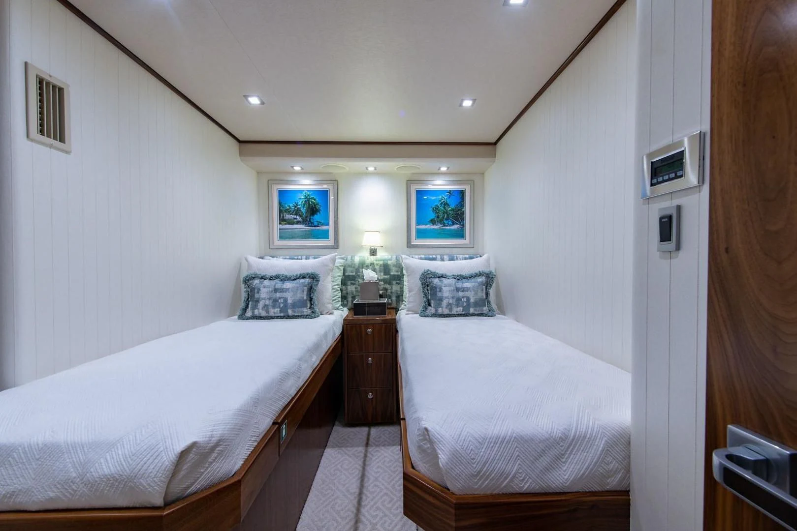 a couple of beds in a room aboard OBSESSION Yacht for Sale