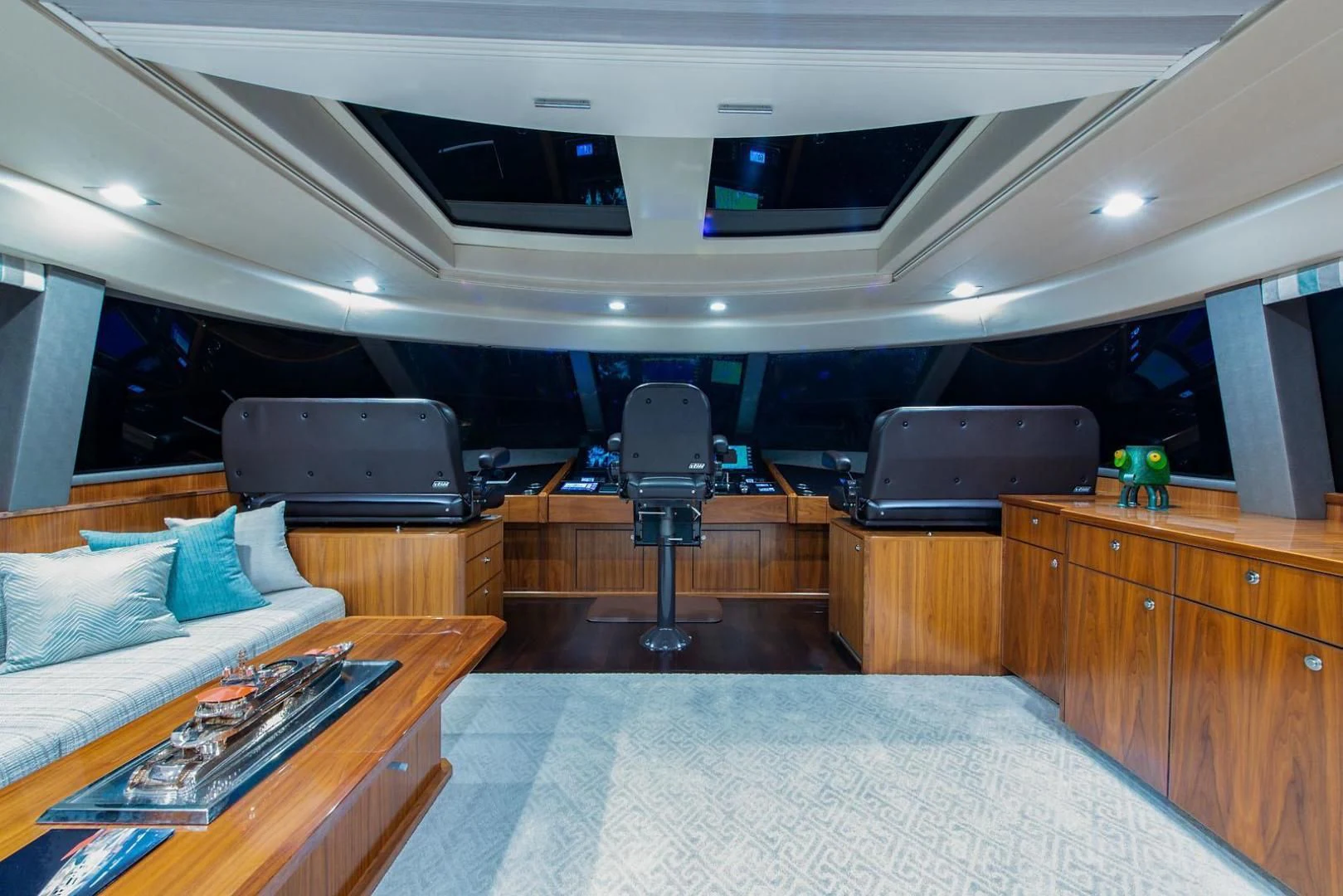 a room with a bed and a desk aboard OBSESSION Yacht for Sale