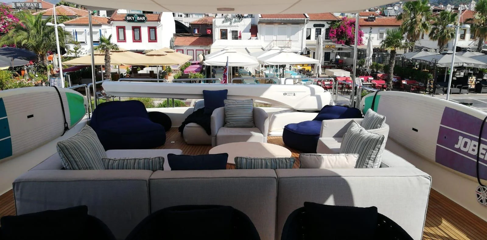 a large patio with couches and chairs aboard HAG Yacht for Sale