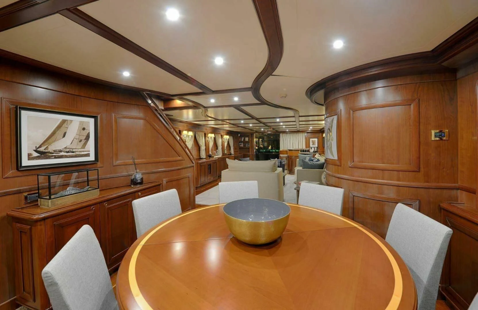 a large kitchen with a table aboard HAG Yacht for Sale